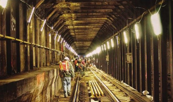 LED Portable Lamp Banks deployed by transit workers in a subway tunnel during shutdown work