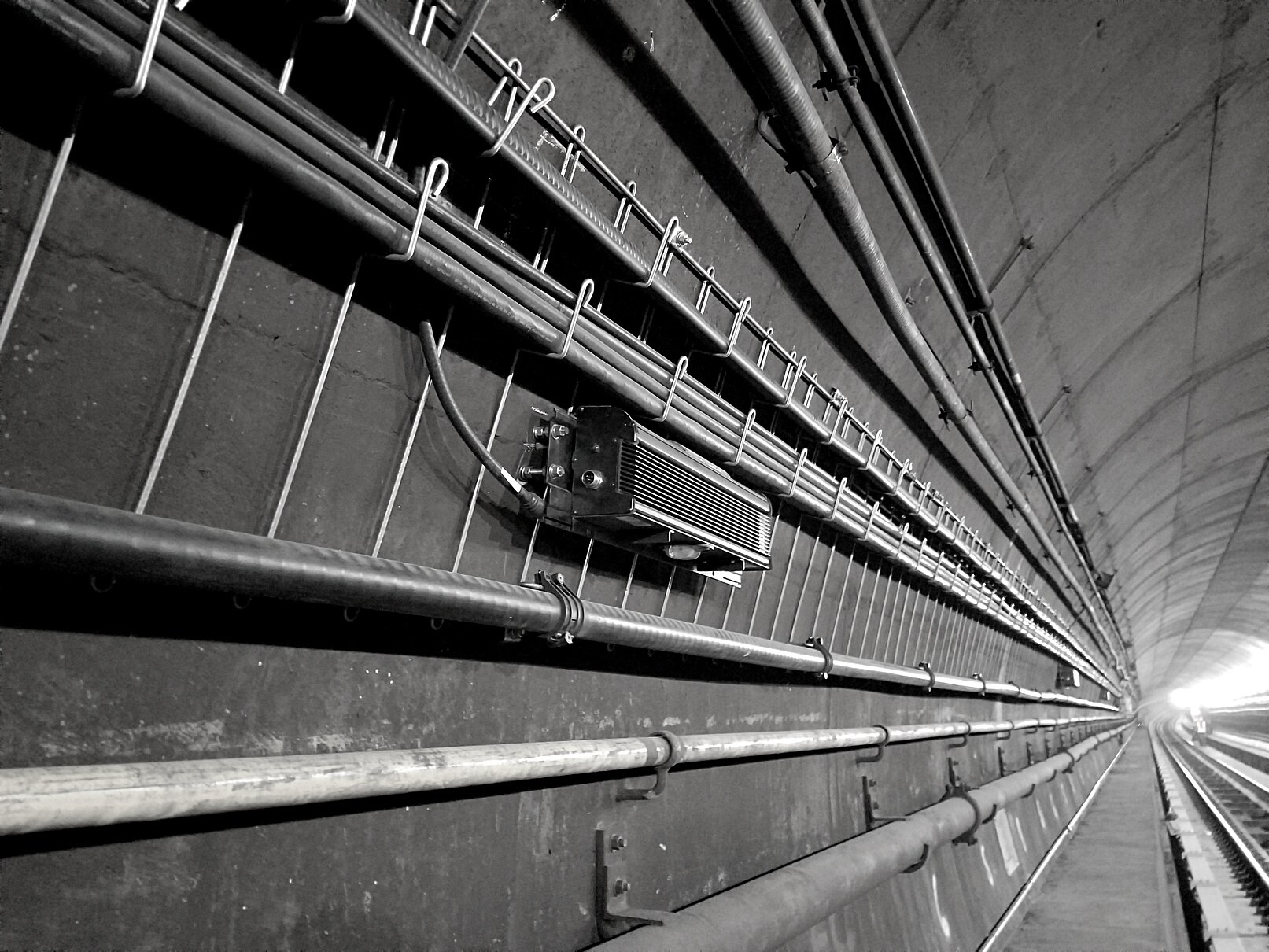 MTA/NYCT Rutgers Tunnel — MTLx tunnel light with clearNET wireless monitoring installed on the under-river tunnel wall